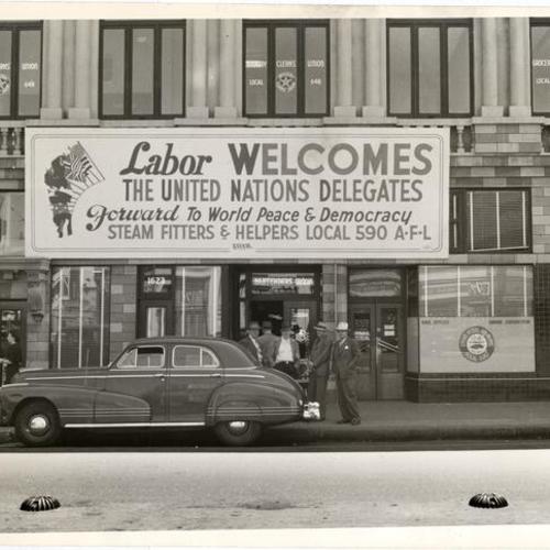 [Large sign, sponsored by Steamfitters Union, welcoming delegates to United Nations Conference, 1945]