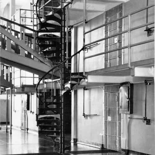 [View of stairs leading from first to second tier of cells at Alcatraz Island prison]