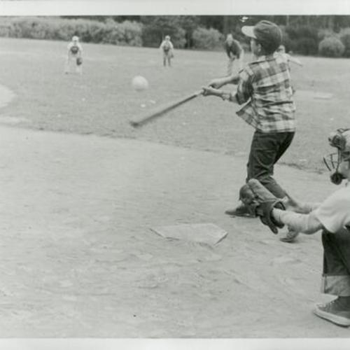 [Ann's father as a child playing baseball with cubscout troop]