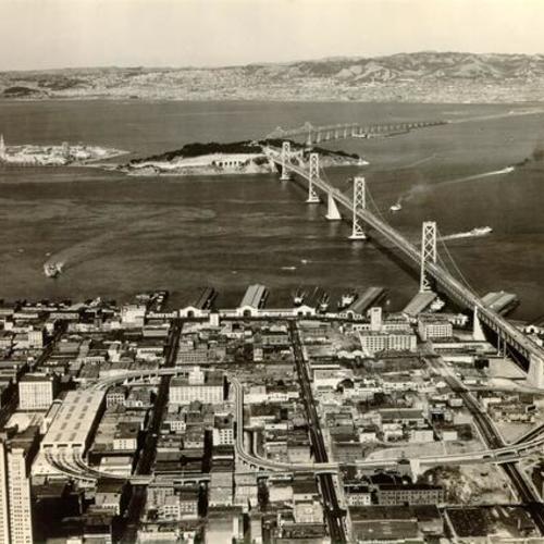 [Aerial view of the San Francisco-Oakland Bay Bridge, showing Treasure Island and Yerba Buena Island]