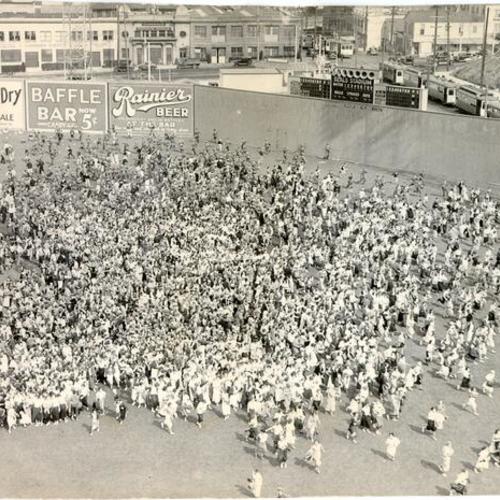 [Crowd of people on the field at Seals Stadium]