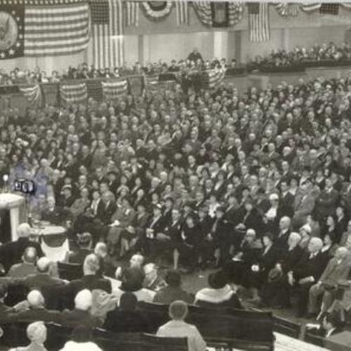 [Man speaking before an audience at an unidentified event in the San Francisco Civic Auditorium]