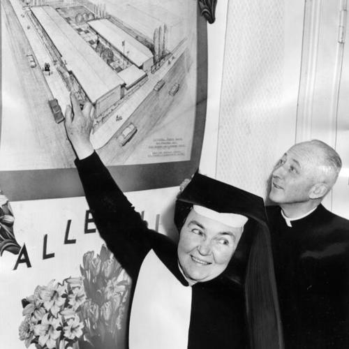 [Sister Mary Ambrose and Bishop Hugh A. Donohue displaying a sketch of a planned new building for Cathedral Presentation School]