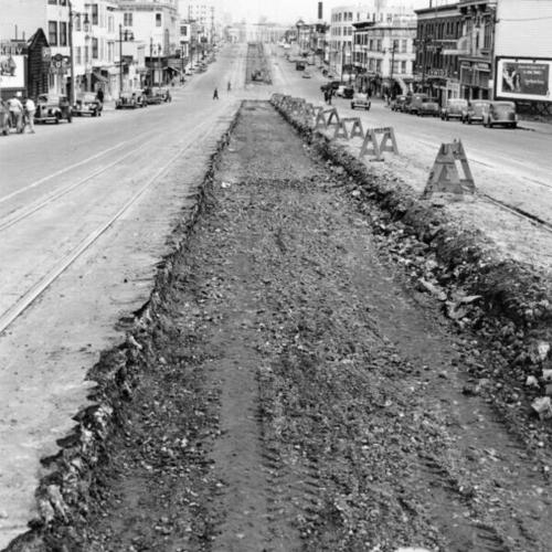 [Cleaned-out roadbed along Market Street]
