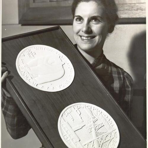[Valentina Romagna displaying original model of United State half dollars in connection with the opening celebration of San Francisco-Oakland Bay Bridge]