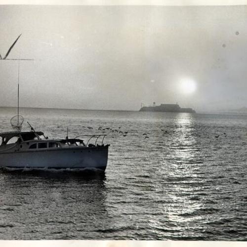 [View of fishing boat on San Francisco Bay with Alcatraz Island in distance]