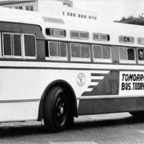 [Muni bus with sign on it reading "Tomorrow's Bus... Today"]
