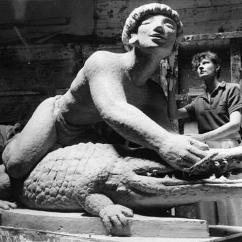 [Sculptor Cecilia Bancroft Graham working on a sculpture for the Golden Gate International Exposition on Treasure Island]