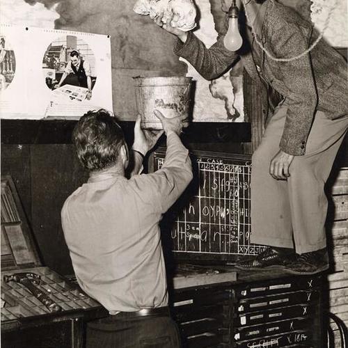 [Frank Kelley director of the Columbia Park Boys Club and Ray Kimball working on a ceiling leak]