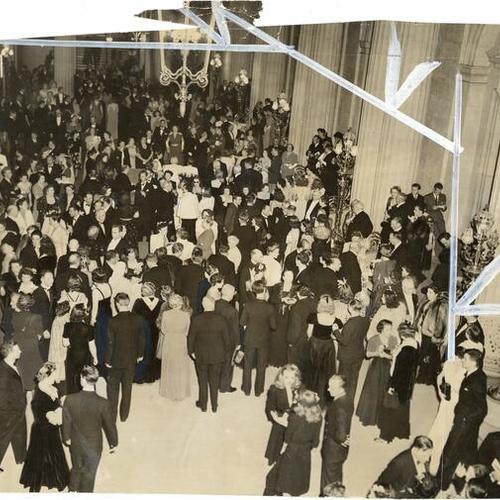 [San Francisco's first wartime opera opening gathered in the foyer of War Memorial Opera House]