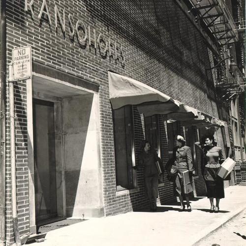 [Susanne Carson, Joyce Hofasie and Nedra Harrison standing near the Maiden Lane entrance to Ransohoff's]