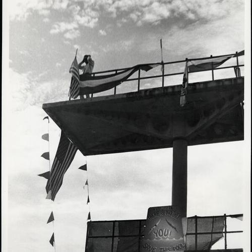 [Sign on high dive of Fleishhacker Pool "Raise Titanic, There is No They, You! Save This Pool"]