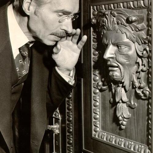 [Dr. Cecil E. Nixon commanding the door to open at the residence at 1555 Broadway]