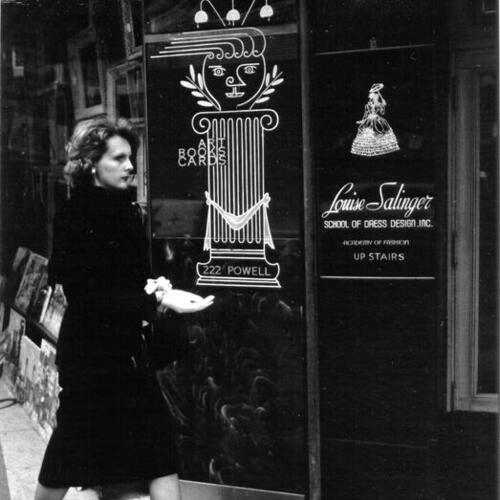 [Woman walking by the Louise Salinger School of Dress Design]