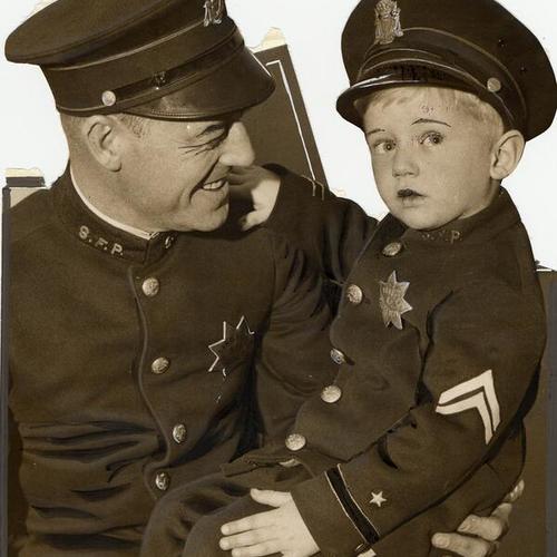 [Teddy Wolf, 3 1/2 years old, and Officer Carlisle Field]