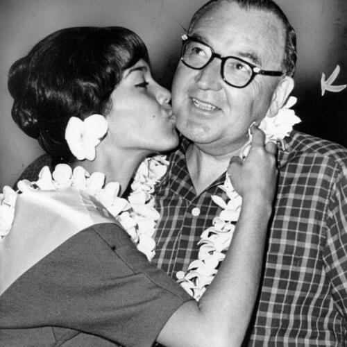 [Governor Brown receives a lei and a kiss]