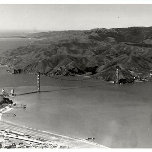 [Aerial view of the Golden Gate Bridge under construction]
