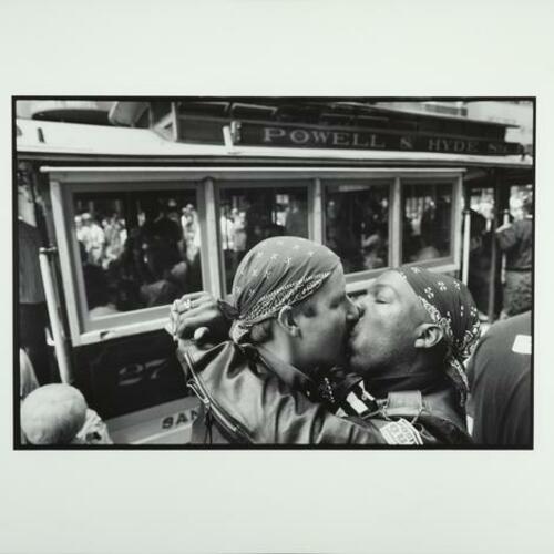Andy Ilves and Tom Tymstone kiss during a Queer Nation kiss-in at the Powell Street cable car turnaround