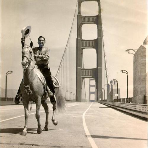 [Los Angeles County Sheriff Eugene Biscailuz riding a horse across the Golden Gate Bridge on Pedestrian Day]