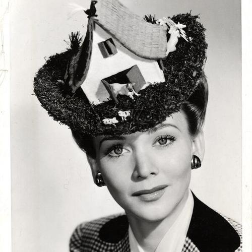 [Actress Carol Landis wearing a wartime hat inspired by camouflage]