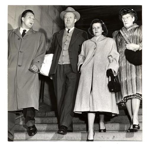 [Mrs. Carolyn O'Malley leaving the Hall of Justice with John O'Malley Sr. and Mrs. Irene O'Malley, parents of Mrs. O'Malley's slain husband]