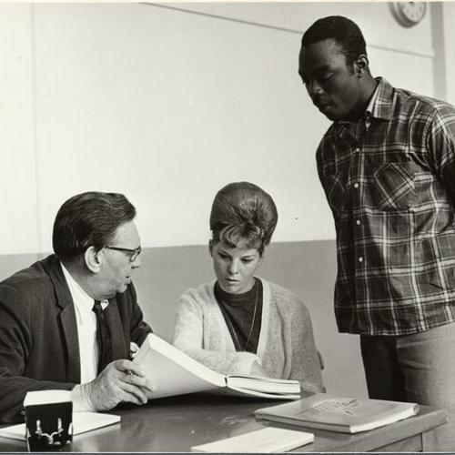 [Teacher with two students at Samuel Gompers High School]