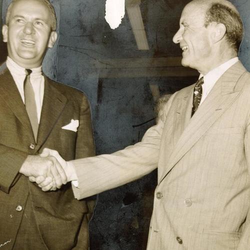 [Businessman Prentiss Cobb Hale shaking hands with Newton J. Hale at the opening of new store]