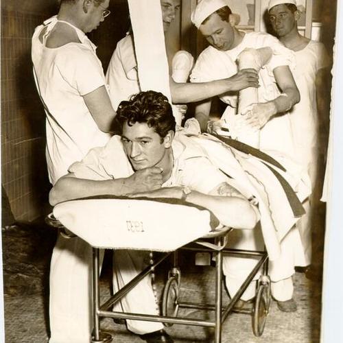 [Soldier wounded at Attu Island receiving treatment at Letterman General Hospital]