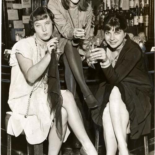 [Three women dressed for a costume party at the Old Spaghetti Factory restaurant]