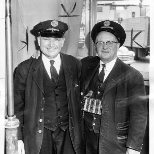 [Motorman Tony Marelich and Conductor Albert Flieger posing on an L line streetcar]