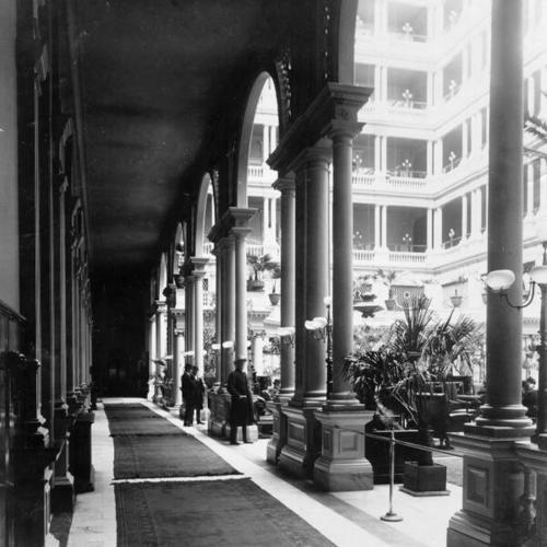 [Hallway by the court of the Palace Hotel]
