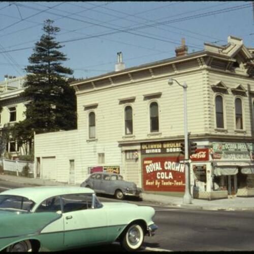 [Corner store at Octavia and Oak, car in foreground]
