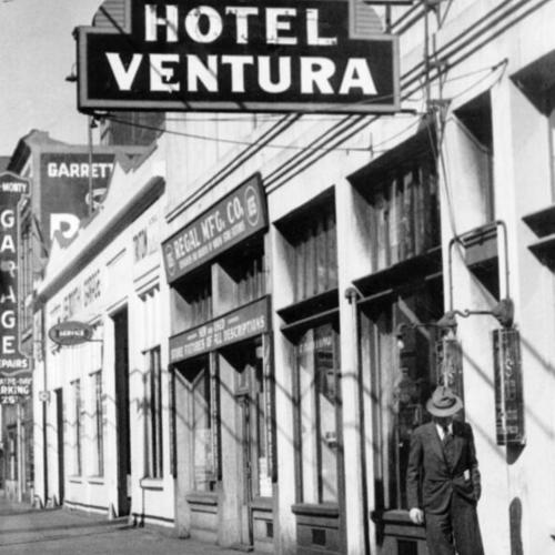 [Man standing in front of the Ventura Hotel]