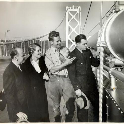 [Engineer Charles Hoehn Jr. giving a tour of the San Francisco-Oakland Bay Bridge to Clarence Hayes, Lucrezia Kemper and John Wolff]