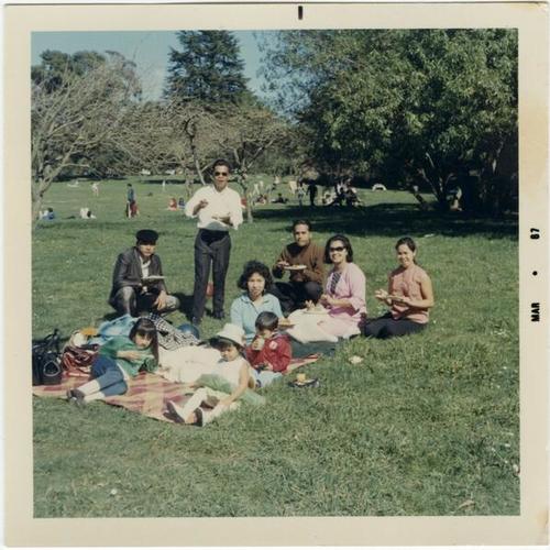 [Friends and family having a picnic at Speedway Meadows in Golden Gate Park]