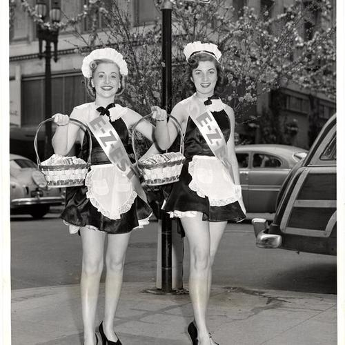 [Phyllis Nadyne and Debby Zatoff dressed up as "E-Z-EST girls" for the Maiden Lane Spring Festival]