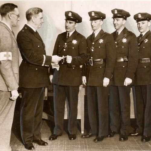 [W. Waters; Chief Quinn; Cops, O. Elvander, J.A. O'Meara, J.E. Curley, and J.V. Erickson]