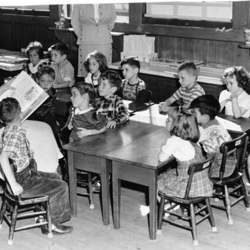 [Cabrillo School teacher Constance Knoph with a class of first graders]