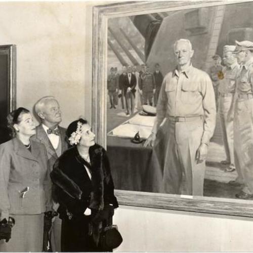 [Adm. Chester W. Nimitz, Mrs. Nimitz, Rear Adm. Bertram Rodgers and Mrs. Rodgers view a portrait of Adm. Nimitz at the De Young Museum in Golden Gate Park]