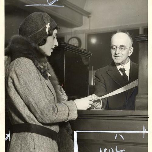 [Cecilia Platt purchasing a ticket from Jim Mason, Southern Pacific ticket agent, at the Ferry Building]