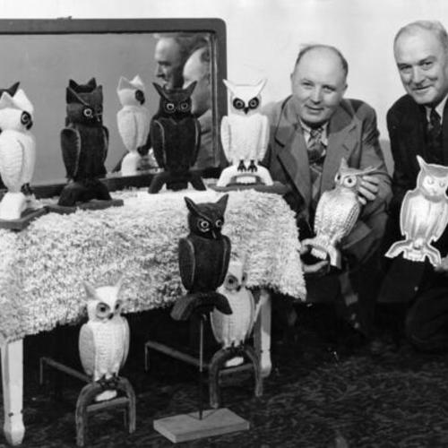 [J. A. Soules and J. R. Swisher, of Decatur Illinois, posing with some of their "All Weather Two-Faced Aluminum Owls" used to scare away pigeons]