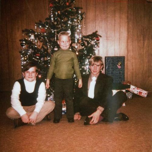 [Three brothers in front of family Christmas tree in 1971]