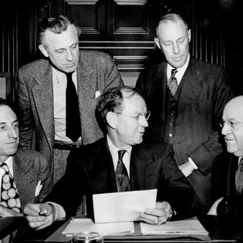 [Harry Bridges meets with members of a fact finding board named to pass on the union's demand for higher wages]