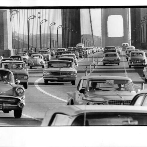 [View of traffic control markers on Golden Gate Bridge during rush-hour commute]