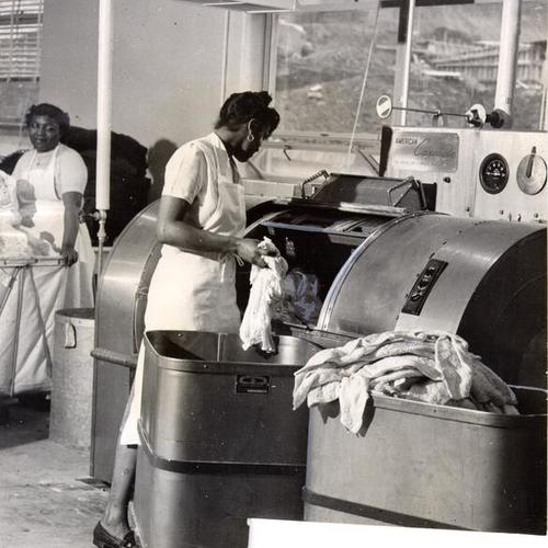 [Workers in the laundry facility at the Youth Guidance Center]