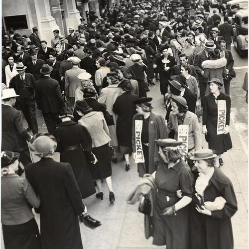 [Strikers picketing in front of the Emporium on Market Street]