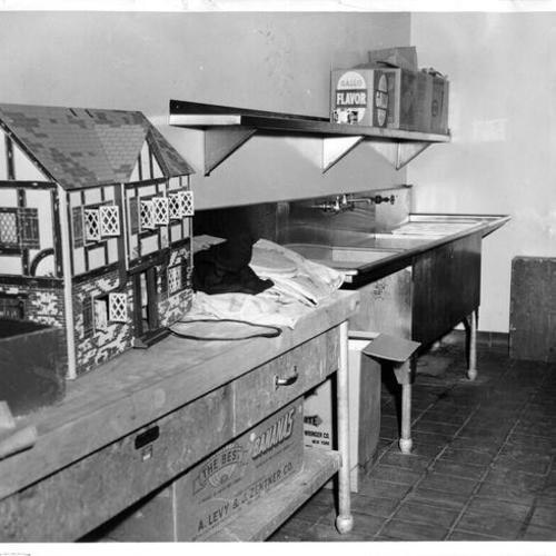[Kitchen at the Youth Guidance Center being used for storage]