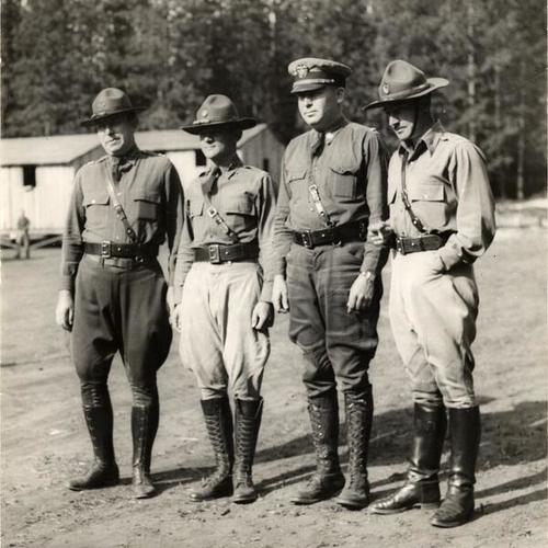 [Captain T.P. Walsh and Lieutenants P.B. Denson, H.H. Carroll and L.G. Bolles at a CCC Forestry Work Camp]