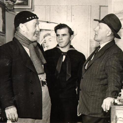 [John Harry Arnell, Libby Curcuru and George Gibson talking to each other at the waterfront]