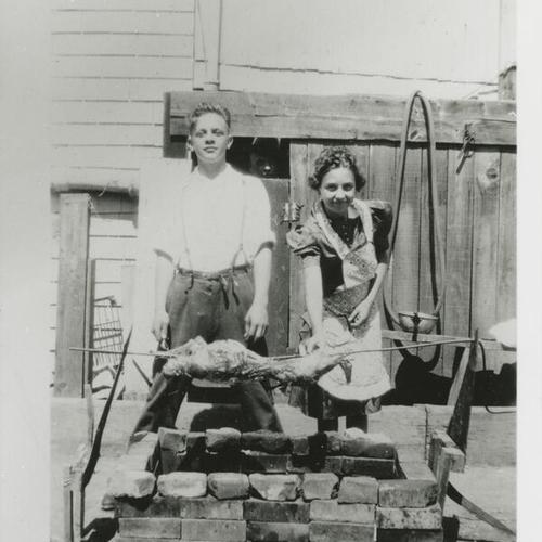 [Fred and Florence and a barbeque in backyard on Oakwood Street]